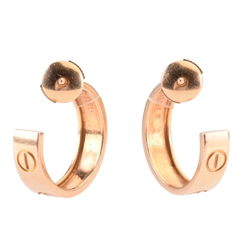 53 - A pair of Cartier 'Love' earrings, each of hoop design with screw motifs, length 2cm, post fittings,... 