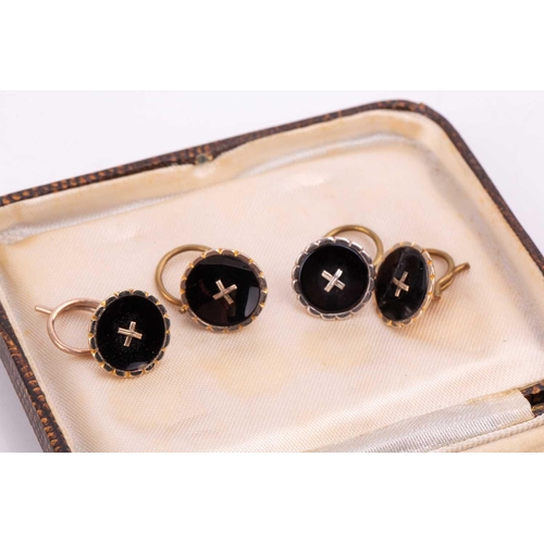 55 - An onyx and diamond dress set comprised of a pair of cufflinks, two dress studs and four buttons, in... 