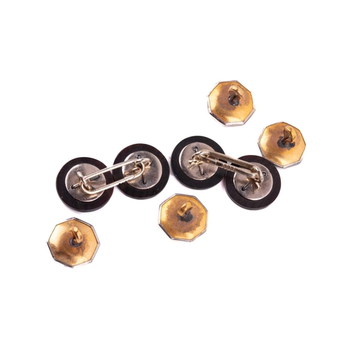 55 - An onyx and diamond dress set comprised of a pair of cufflinks, two dress studs and four buttons, in... 