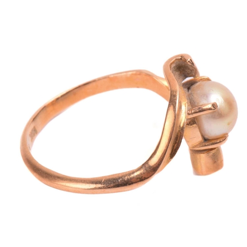 57 - A cultured pearl ring, the four claw set yellow pearl approximately 8mm diameter set in yellow metal... 