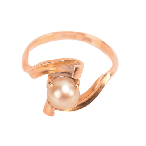 57 - A cultured pearl ring, the four claw set yellow pearl approximately 8mm diameter set in yellow metal... 