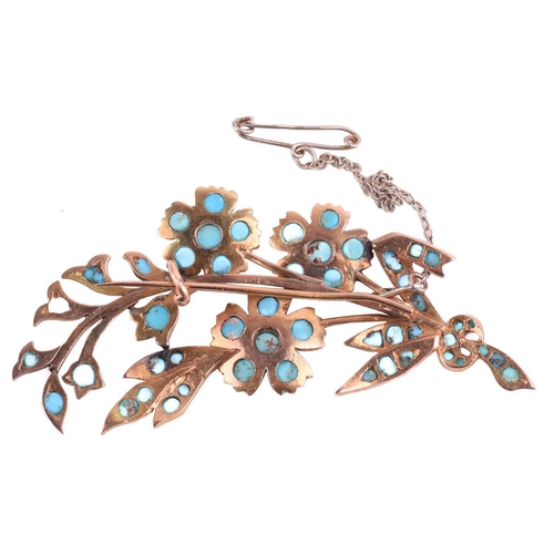 59 - A turquoise floral brooch designed as a spray of flowers, set throughout with cabochon turquoise (on... 