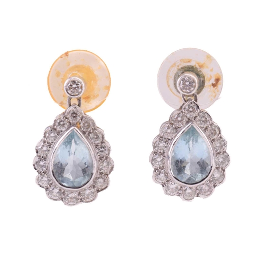 63 - A pair of aquamarine and diamond pendant earrings, each set with a pear shape aquamarine surrounded ... 