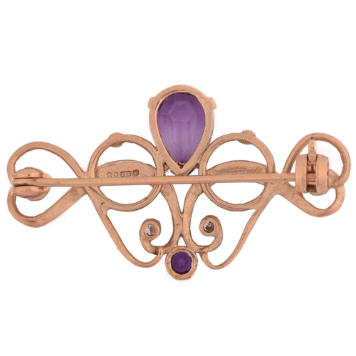 67 - An amethyst and diamond brooch, the brooch with a curvilinear design set with a pear shape of amethy... 