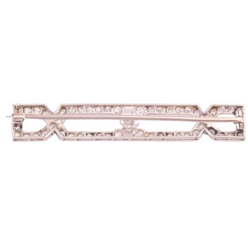 68 - An Art Deco diamond brooch, set with old cut and single cut diamonds in a geometric design, with a t... 