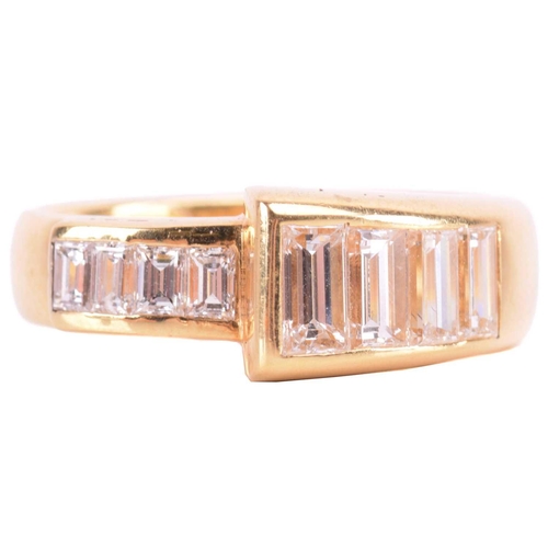 69 - A diamond dress ring, set with a graduated row of baguette cut diamonds, with a total estimated diam... 