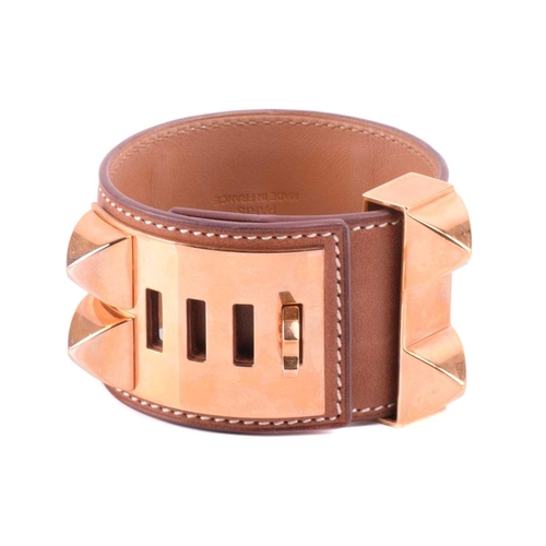 77 - Hermès - a wide 'Collier de Chien' leather bracelet with gold-tone metal, in tanned calfskin leather... 