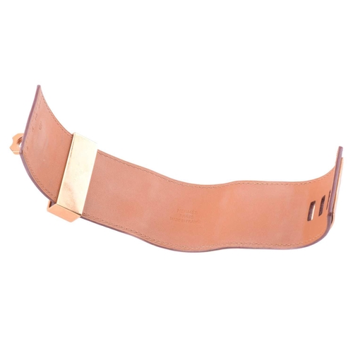 77 - Hermès - a wide 'Collier de Chien' leather bracelet with gold-tone metal, in tanned calfskin leather... 