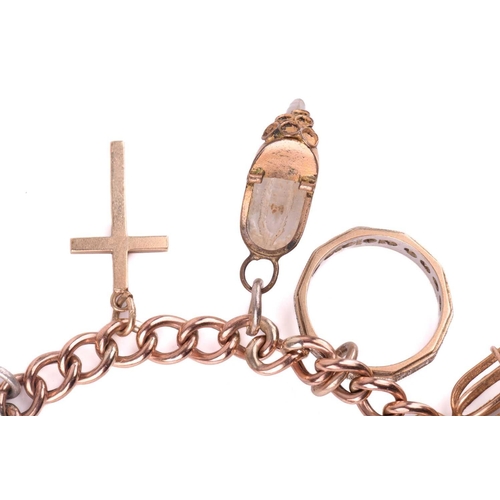 78 - A charm bracelet in 9ct rose gold, consisting of a curb link chain, suspending with a collection of ... 