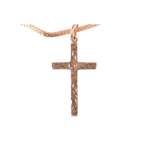 81 - A gold cross with hallmarks for 9ct gold, with a foxtail chain marked 750 measuring 40.5cm in length... 