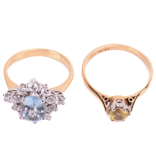 83 - Two gem-set rings; featuring a yellow sapphire solitaire ring, centred with a circular-cut yellow sa... 