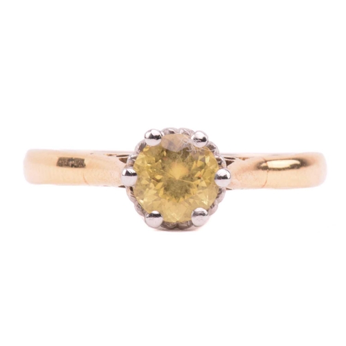 83 - Two gem-set rings; featuring a yellow sapphire solitaire ring, centred with a circular-cut yellow sa... 