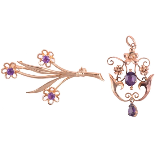 87 - An amethyst floral spray brooch with hallmarks for 9ct gold, measuring 48mm in length, a floral pend... 