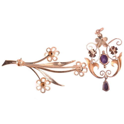 87 - An amethyst floral spray brooch with hallmarks for 9ct gold, measuring 48mm in length, a floral pend... 