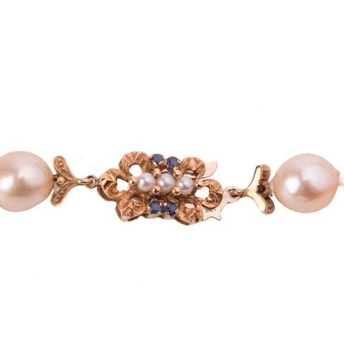 94 - A single-row baroque pearl necklace, composed of sixty-three, creamy white baroque pearls of varying... 