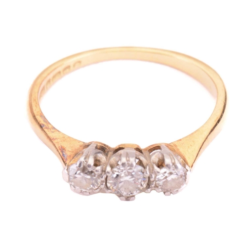 95 - A diamond three-stone ring, set with a trio of old cut diamonds with a total estimated weight of 0.5... 