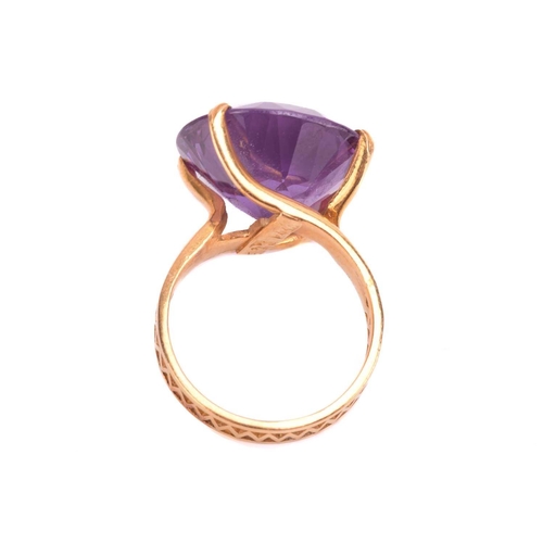 96 - A synthetic colour change sapphire cocktail ring, the synthetic sapphire colour changing from blue t... 