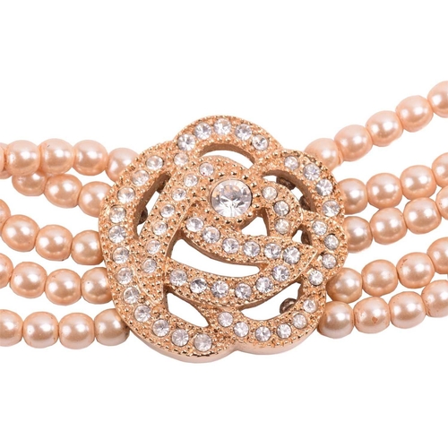 105 - Christian Dior - a faux pearl choker and matching pair of stud earrings; the necklace comprises a ro... 