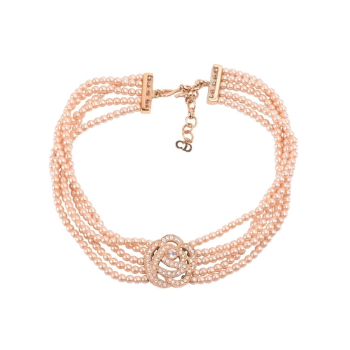 105 - Christian Dior - a faux pearl choker and matching pair of stud earrings; the necklace comprises a ro... 