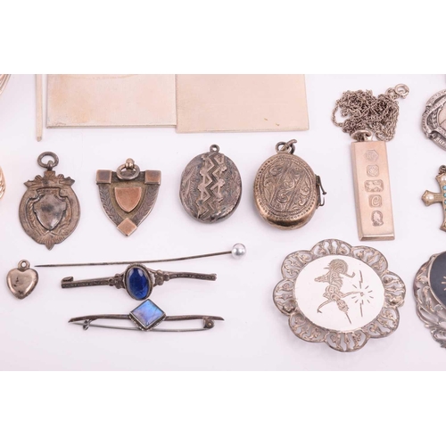 106 - A collection of miscellaneous silver and white metal items, including a hallmarked silver medal on a... 