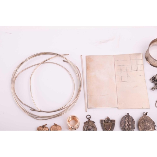 106 - A collection of miscellaneous silver and white metal items, including a hallmarked silver medal on a... 