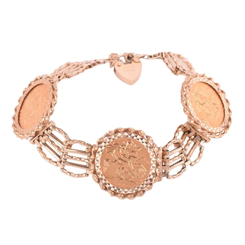110 - A 9ct gold gate link bracelet mounted with three half sovereigns, comprising three Elizabeth II 1982... 