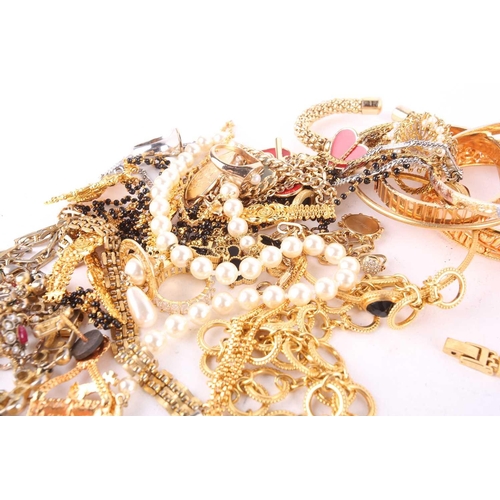 115 - A large quantity of assorted base metal jewellery, including examples of yellow-toned necklaces, ban... 