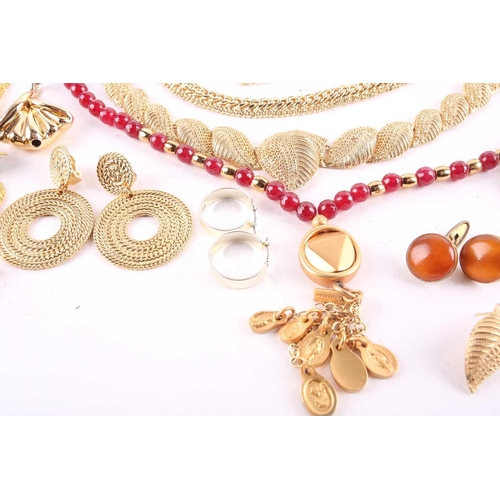 115 - A large quantity of assorted base metal jewellery, including examples of yellow-toned necklaces, ban... 
