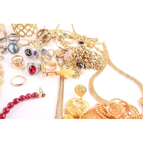 115 - A large quantity of assorted base metal jewellery, including examples of yellow-toned necklaces, ban... 