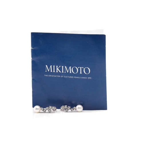 16 - Mikimoto. A pair of Mikimoto pearl and diamond pendant earrings; comprising a drop of five princess ... 