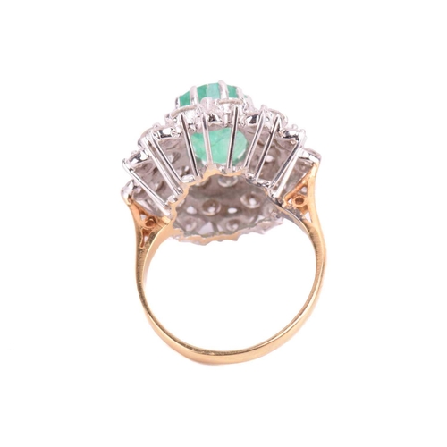 32 - An emerald and diamond cluster ring, the fracture-filled emerald centrally set within a cluster of r... 