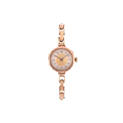 329 - A 9ct gold lady's wristwatch on a 9ct metal core bracelet with hand-wound Swiss movement in a 9ct go... 