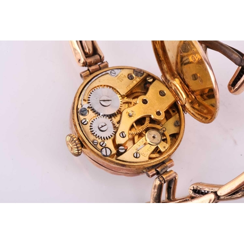 329 - A 9ct gold lady's wristwatch on a 9ct metal core bracelet with hand-wound Swiss movement in a 9ct go... 