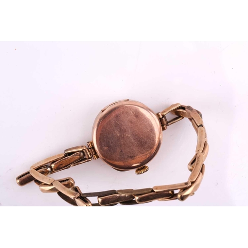329 - A 9ct gold lady's wristwatch on a 9ct metal core bracelet with hand-wound Swiss movement in a 9ct go... 
