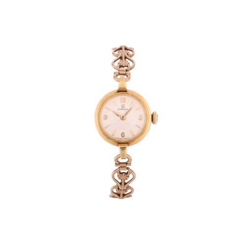 342 - A lady's Omega 9ct gold dress watch and a Tissot 9ct gold dress watch. It features a manual wind Swi... 