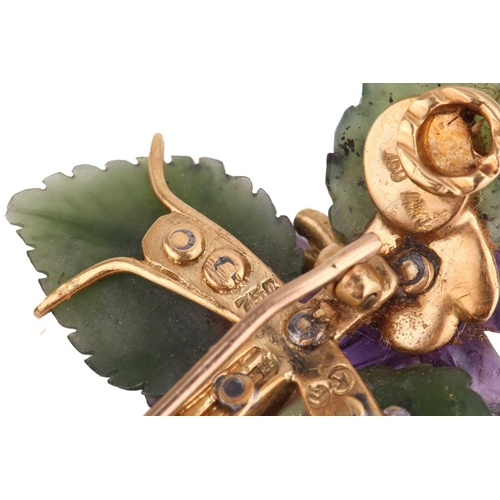 4 - A suite of carved nephrite and amethyst brooch and earrings designed as floral sprays; the brooch bl... 
