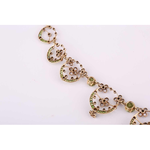 48 - An Edwardian diamond, peridot and demantoid garnet necklace, circa 1910, the floral garland design s... 