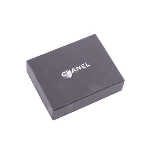 57 - Chanel - an interlocking CC logo brooch encrusted with baguette rhinestones, signed A18V, 5.2 cm wid... 