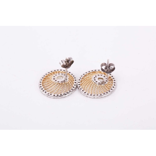 61 - A silver and silver gilt necklace with earrings and ring en suite; of swirling rope twist wirework d... 