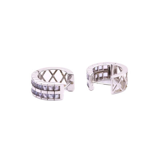 63 - A collection of three pairs of earrings and a ring, including a pair of diamond drop shape cluster e... 
