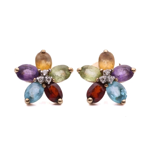 63 - A collection of three pairs of earrings and a ring, including a pair of diamond drop shape cluster e... 