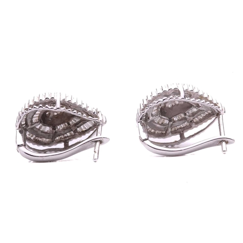 63 - A collection of three pairs of earrings and a ring, including a pair of diamond drop shape cluster e... 