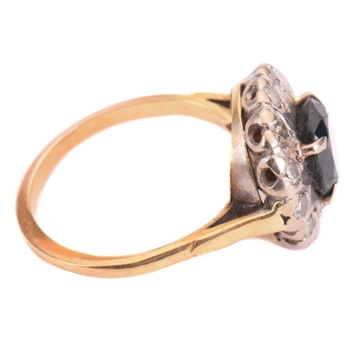 69 - A sapphire and diamond cluster ring, set to the centre with a sapphire measuring 7.9 x 6.6mm, encirc... 