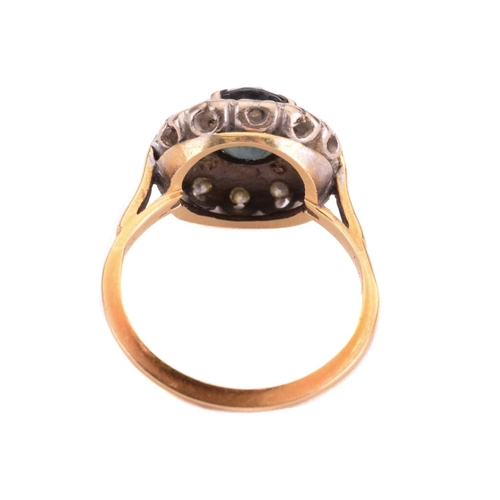 69 - A sapphire and diamond cluster ring, set to the centre with a sapphire measuring 7.9 x 6.6mm, encirc... 