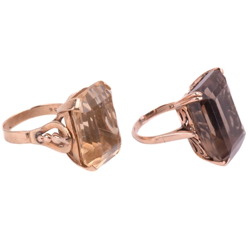 7 - Two large quartz cocktail rings; the first comprises an octagonal step-cut smokey quartz of brown co... 