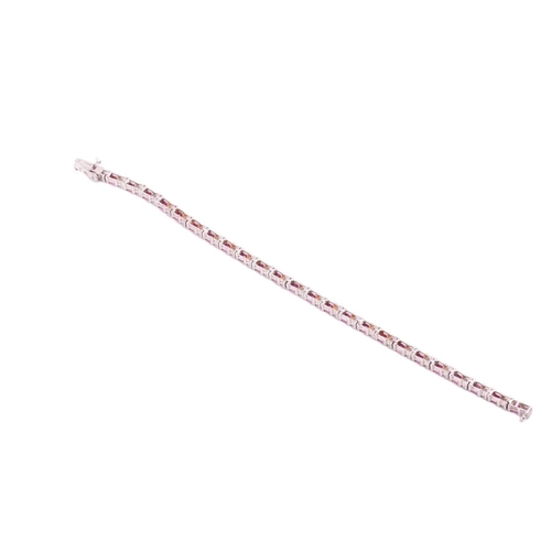 71 - A tennis bracelet set with diamonds and synthetic rubies, articulated mounts alternating with square... 