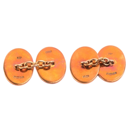 93 - A pair of game birds cufflinks in 9ct yellow gold, each oval panel depicting an enamelled scene of a... 