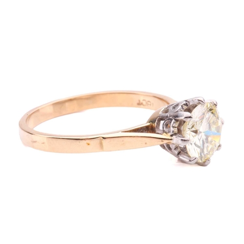 94 - A diamond solitaire ring set with a light yellow round brilliant cut diamond with an estimated weigh... 