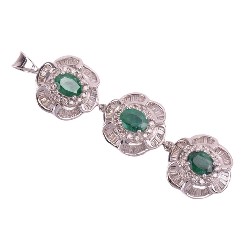 96 - A suite of emerald and diamond flowerhead pendants; two identical flowerhead clusters each centred w... 