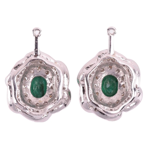 96 - A suite of emerald and diamond flowerhead pendants; two identical flowerhead clusters each centred w... 